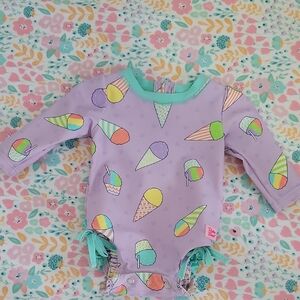 Ruffle Butts Purple Bodysuit with Whimsical Ice Cream Design